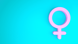 Pink female gender symbol on a light blue background